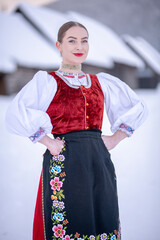 Young beautiful slovak woman in traditional costume. Slovak folklore