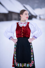 Young beautiful slovak woman in traditional costume. Slovak folklore