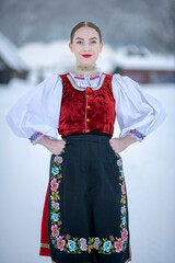 Young beautiful slovak woman in traditional costume. Slovak folklore