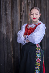 Young beautiful slovak woman in traditional costume. Slovak folklore