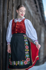 Young beautiful slovak woman in traditional costume. Slovak folklore