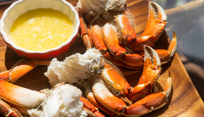 Close-up of boiled cooked Organic Alaskan King Crab Legs with sauce Butter and lemons, Alaskan King...