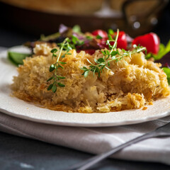 Salt cod brandade garnished with thyme. Salt cod is blended with potatoes, milk, garlic, and olive...