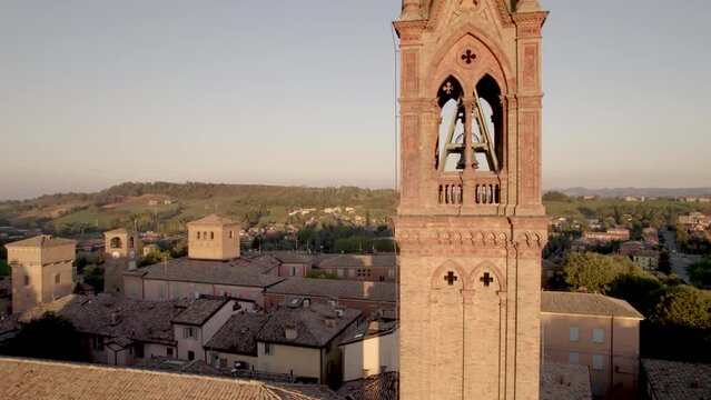 drone footage view of tower of Castelvetro di Modena medieval village in Emilia Romagna during sunset 