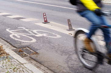 The cyclist travels on a bicycle path.