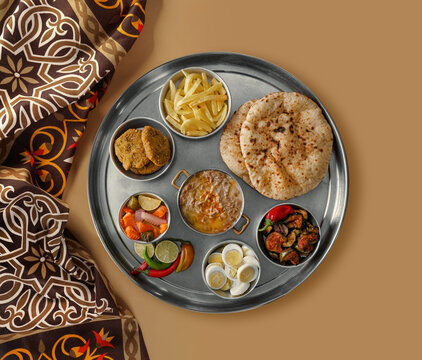 Arabic cuisine, Egyptian Breakfast - Beans; Middle Eastern traditional breakfast. It's also Ramadan food 'Suhur' or 'Shoor', Middle eastern, Arabic traditional breakfast with falafel, foul.