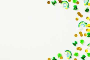 Frame of St Particks day decorations on white table. Flat lay, top view, copy space. Happy Saint Partick's Day banner template.