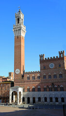 Fototapeta na wymiar Tower called TORRE DEL MANGIA in Siena Italy at main square called PIAZZA DEL CAMPO