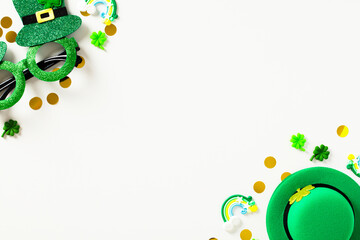 Frame of St Particks day holiday decorations on white background. Flat lay, top view, copy space.