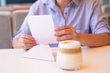 Closeup photography of woman,holding blank certificate gift with wax seal.
