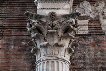 Corinthian capital and detail of the imposing external walls of the Pantheon in Rome.