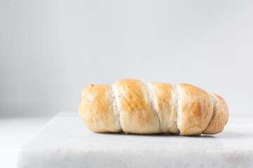 Sausage roll on a marble tray, twisted sausage roll on a marble tray, Large pigs in a blanket snack