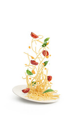 Pasta with tomatoes and basil falling into a plate, levitation.