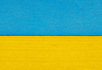Bicolor wooden textured background in blue and yellow colours.Colorful wooden texture. Blue and yellow separated wooden background.  Ukrainian flag.