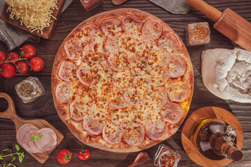 Brazilian pizza with mozzarella, pork loin and oregano (Pizza de lombinho) - Top view.