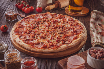 Brazilian pizza with tomato sause, mozzarella, pork loin, bacon and oregano (Pizza de lombinho e bacon)