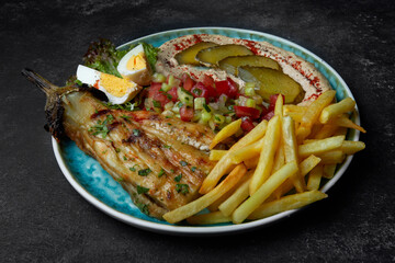 french fries with baked eggplant, eggs, vegetable salad