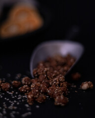 sugar nuts in a metal spoon