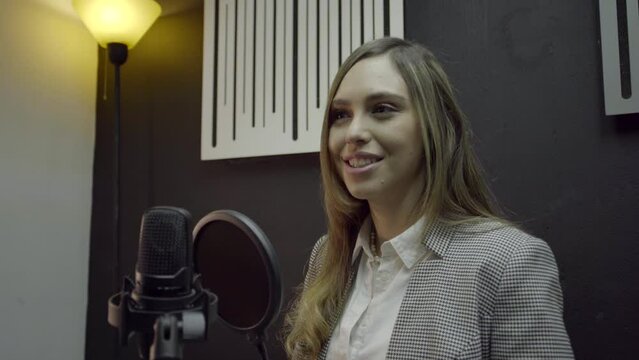Empowered young girl hosting a motivational feminist podcast