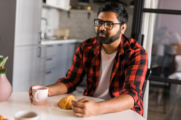 Couple drinking a morning coffee together. Man talks with her wife - lifestyle and communication family concept