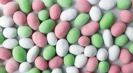Background of multicolored chocolate candy. Close-up, top view