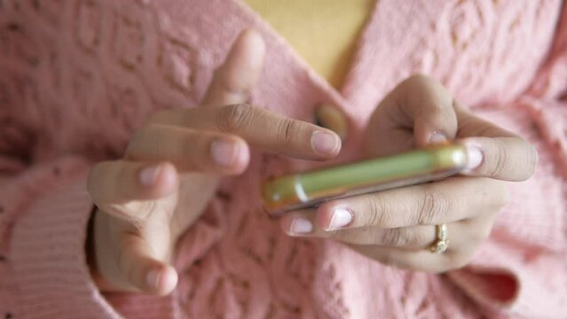 close up of women hand holding smart phone 
