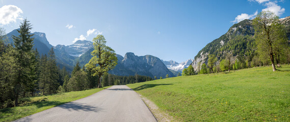 idyllic country road to Ahornboden valley, alpine landscape austria tirol, karwendel mountains in spring