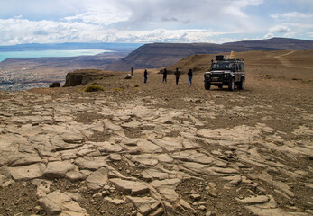 Group of people and 4x4 car high in the mountains in El Calafate © Grace Langbeck