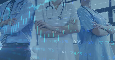 Image of financial data processing over midsection of male and female doctors