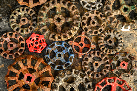 Vintage Plumbing Faucet Handles On Dirty Metal Background