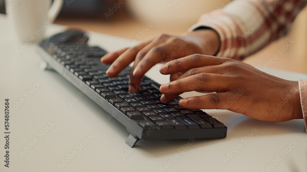 Poster young adult typing data to create report on computer, using keyboard to send professional email. fre