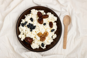 Cottage cheese with nuts and dried fruits.