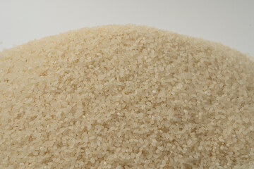 The fruit of rice grown mainly in Asia