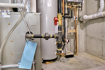 Furnace gas line and shutoff valve in concrete basement mechanical room