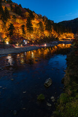日本　愛知県豊田市足助町　ライトアップされた香嵐渓の飯盛山の紅葉と巴川の夜景