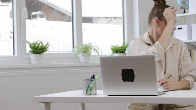 Young Mother Is Working At Laptop. Homeoffice