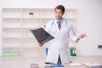 Young male doctor radiologist working in the clinic