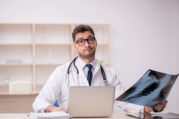 Young male doctor radiologist working in the clinic