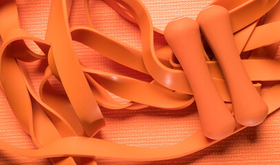 orange fitness background.orange fitness equipment on orange background for background banner