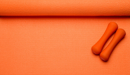 orange fitness background.orange fitness equipment on orange background for background banner