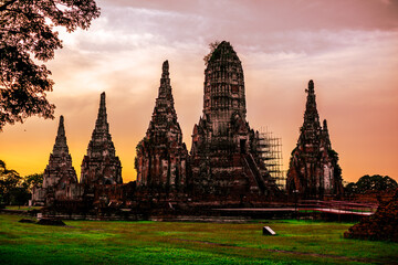 Fototapeta premium Blurred abstract background of twilight. With old ancient sites, large pagodas to study and learn the history of (Wat Chaiwatthanaram) in Ayutthaya Province of Thailand