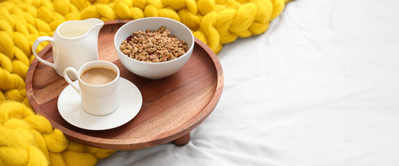 Tray with tasty breakfast on bed. Banner for design