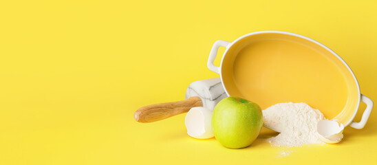 Ingredients for preparing bakery and utensils on yellow background with space for text