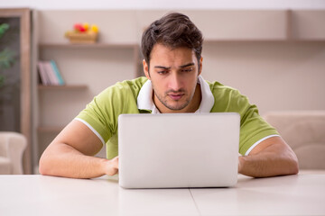 Young man working from home during pandemic