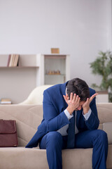 Young male employee working from home during pandemic