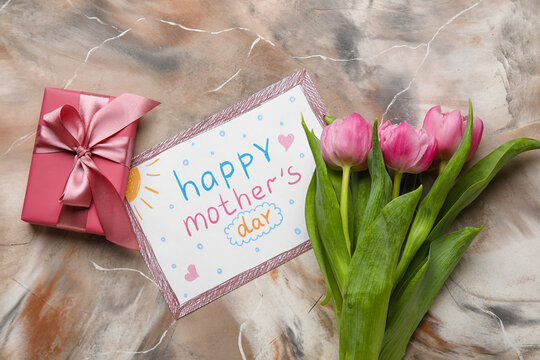 Picture with text HAPPY MOTHER'S DAY, tulip flowers and gift box on grunge background