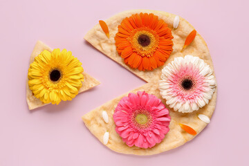 Pizza with beautiful gerbera flowers on pink background