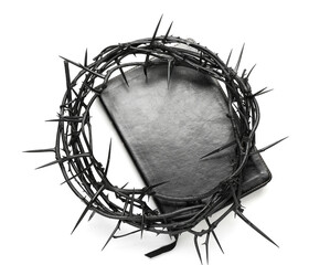 Fototapeta na wymiar Crown of thorns with Holy Bible on white background