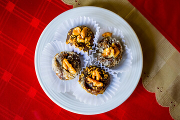 Top view special iranian four candies portion made of dates and walnuts in iranian cafe in Shapouri...