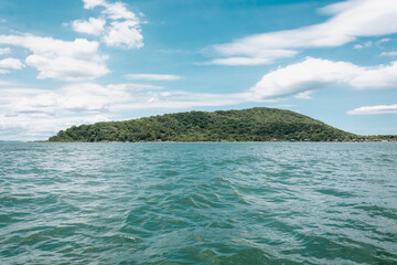 An image of an ocean with the continent in the background. The vast expanse of the ocean dominates...